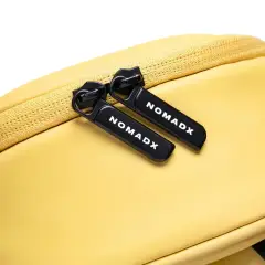 Zipper pull and NomadX branding on the Butter Yellow bag
