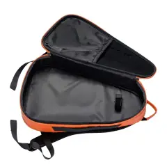 Inside the NomadX Hardshell Padel Backpack in Sunset Orange, compartments open