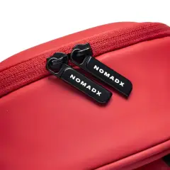Zipper pull and NomadX branding on the Cherry Red bag