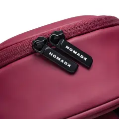 Zipper pull and NomadX branding on the Deep Burgundy bag
