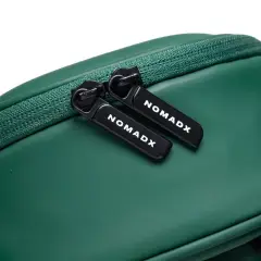 Zipper pull and NomadX branding on the Forest Green bag