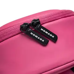 Zipper pull and NomadX branding on the Hot Pink bag