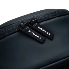 Zipper pull and NomadX branding on the Pitch Black bag