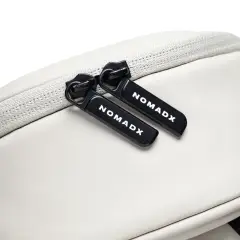 Zipper pull and NomadX branding on the Snow White bag
